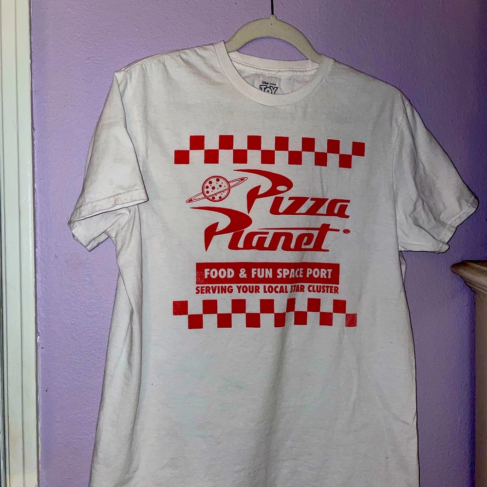 For any toy story fans this cute T-shirt is white and red from pizza planet:)